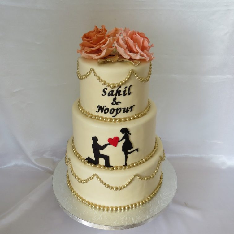 Ivory engagement cake with peach roses