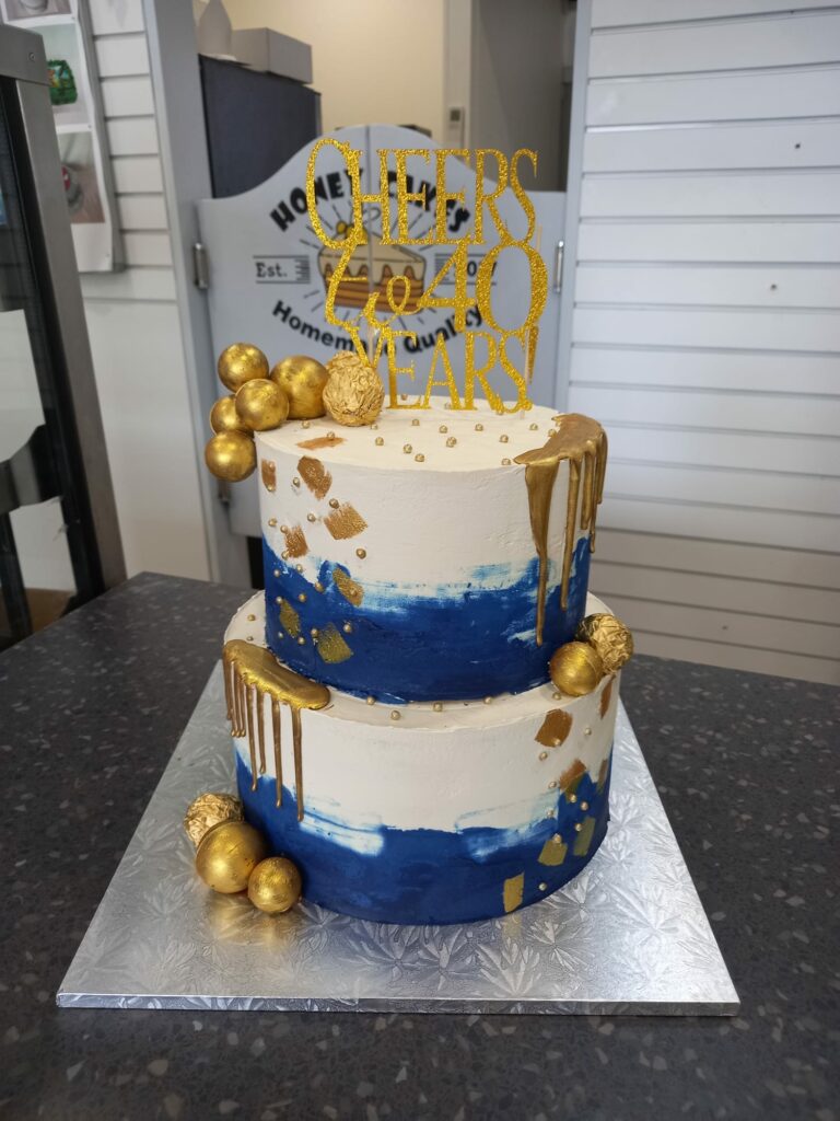 Navy , white and gold cake